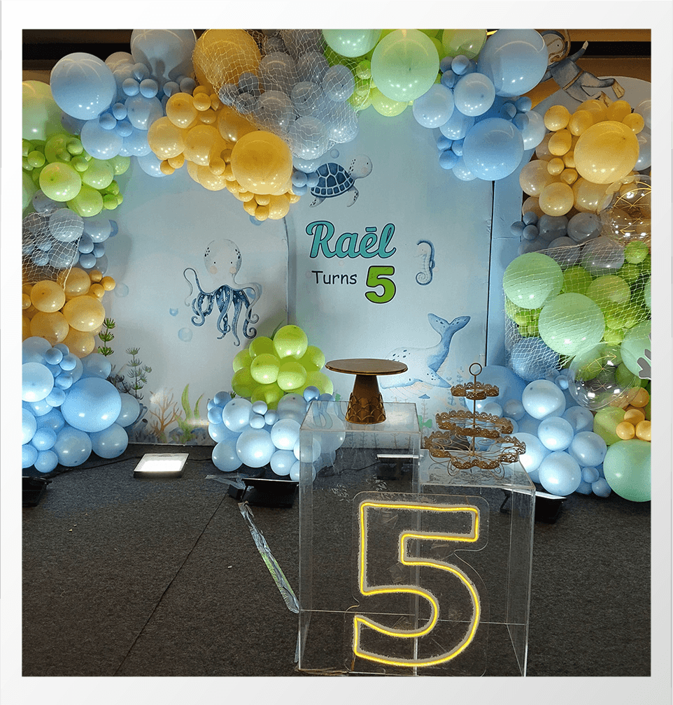 Kids birthday decoration with balloons and cake setup 6