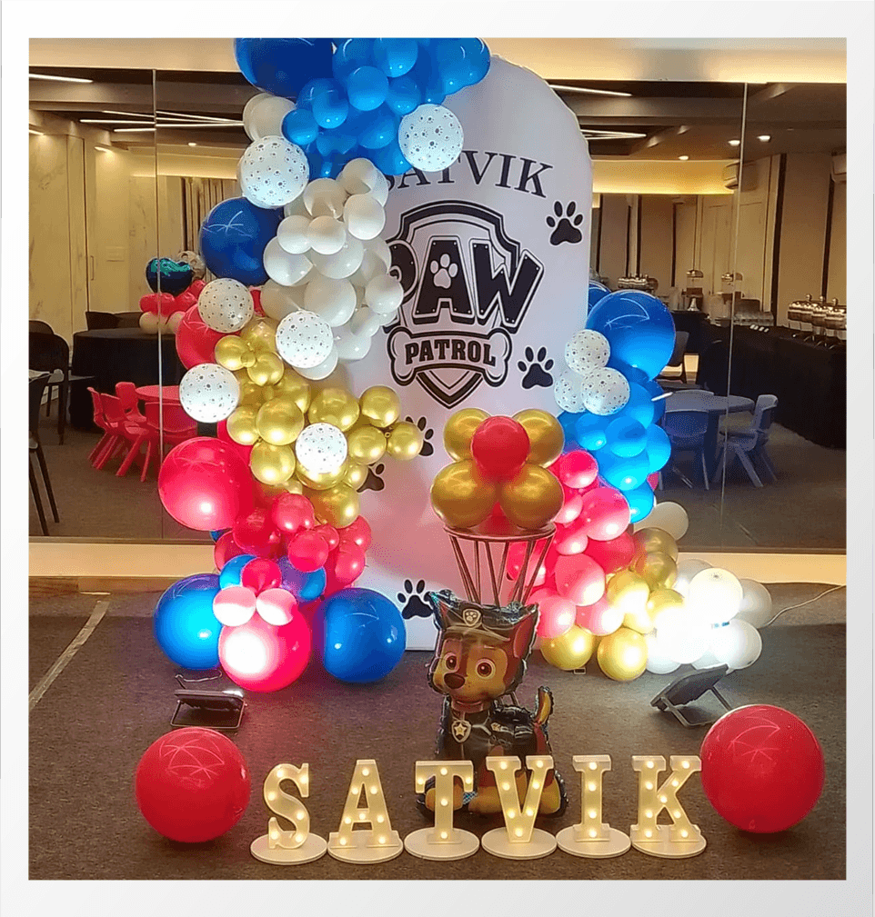 Kids birthday decoration with balloons and cake setup 3
