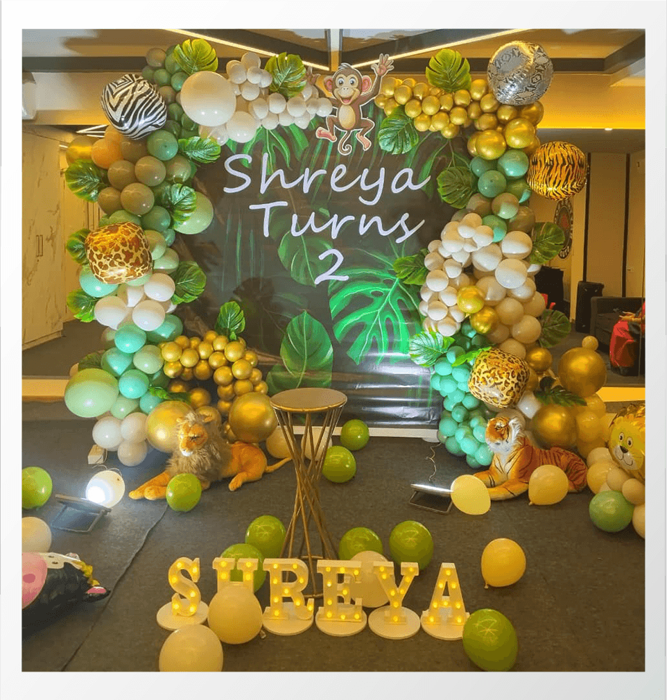 Kids birthday decoration with balloons and cake setup 9